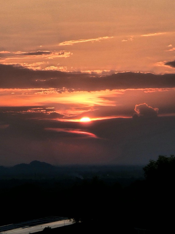 Dramatic sunset sky over Samanvaya